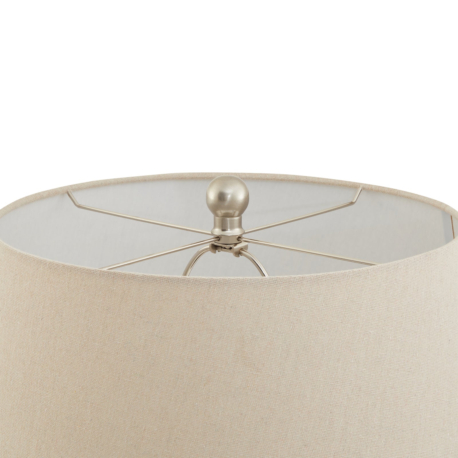 Close-up of a beige lampshade with a metallic fixture on a white background
