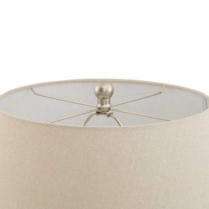 Close-up of a beige lampshade with a metallic fixture on a white background