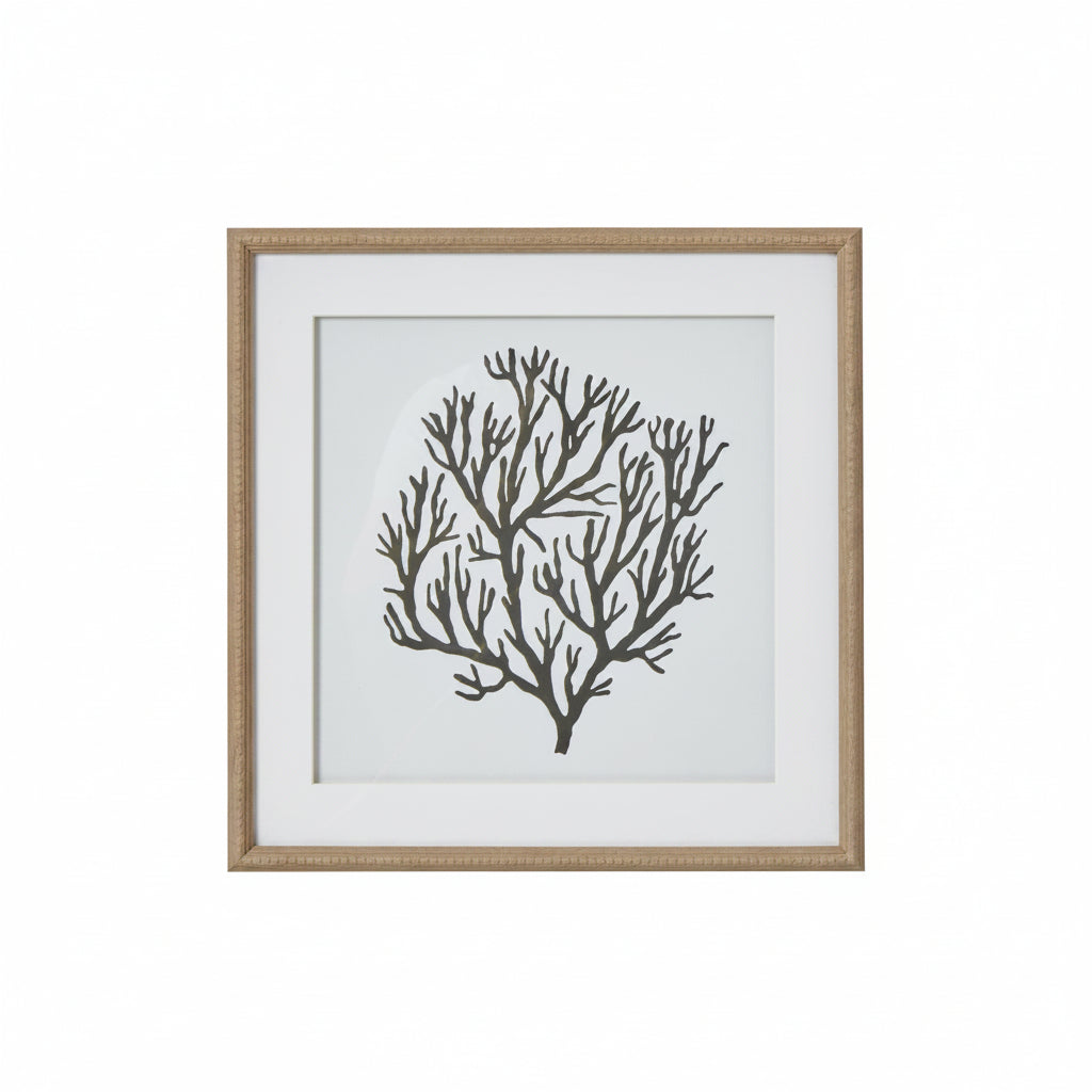Framed artwork of a black coral design on a white background