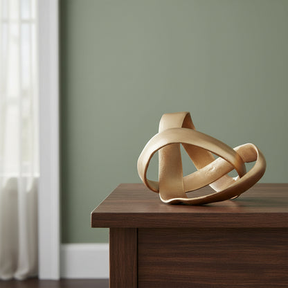Gold abstract sculpture on a white background