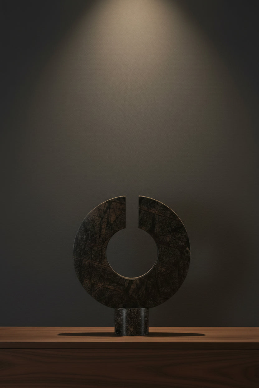 Decorative stone sculpture with a circular design on a white background