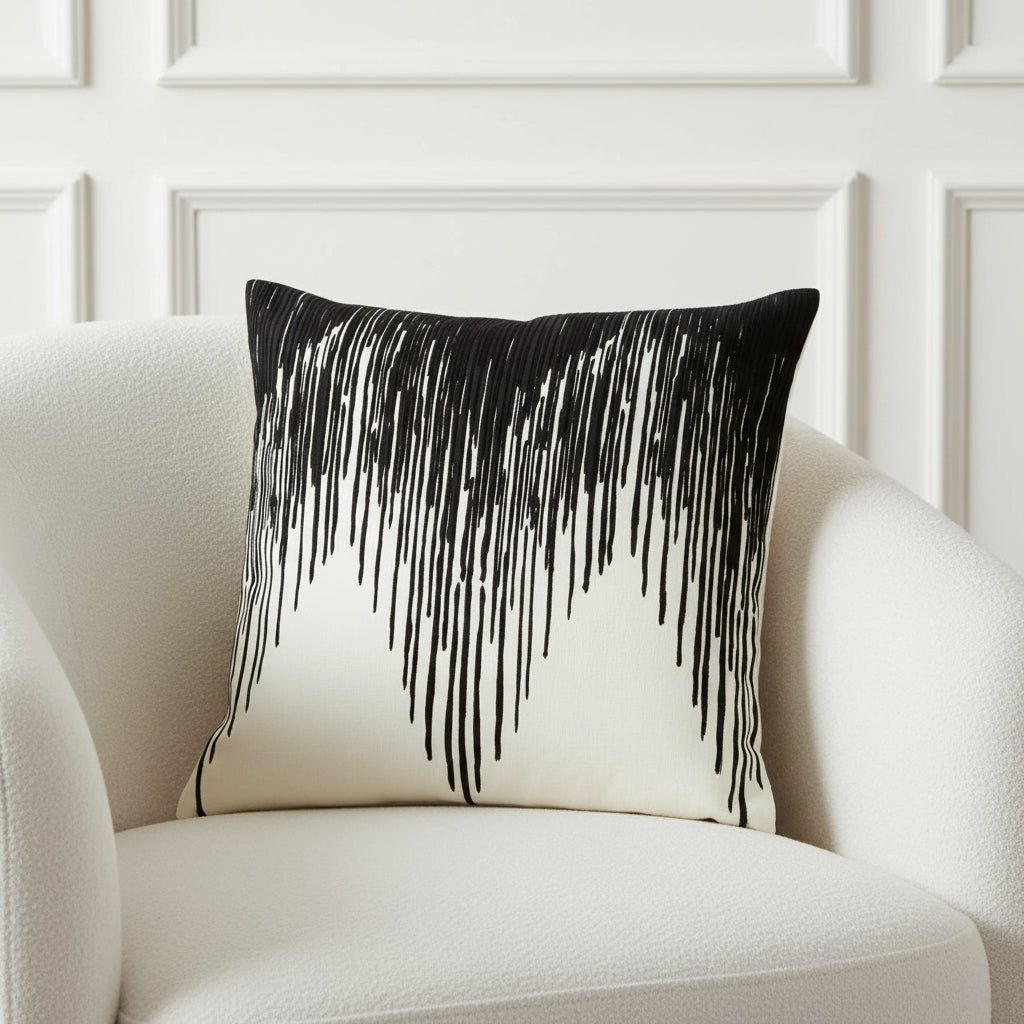 Decorative pillow with black fringe on a white background