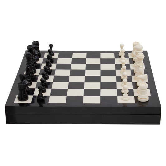 A black and white wooden chessboard with black and white chess pieces arranged on a clean white background.