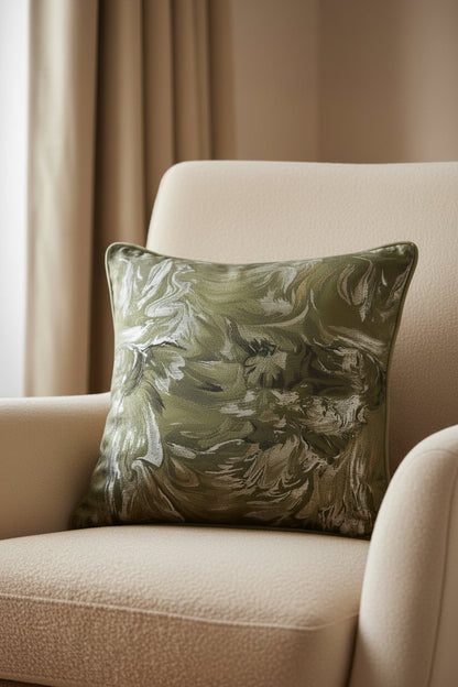 Decorative pillow with a marbled pattern in green and gray on a white background