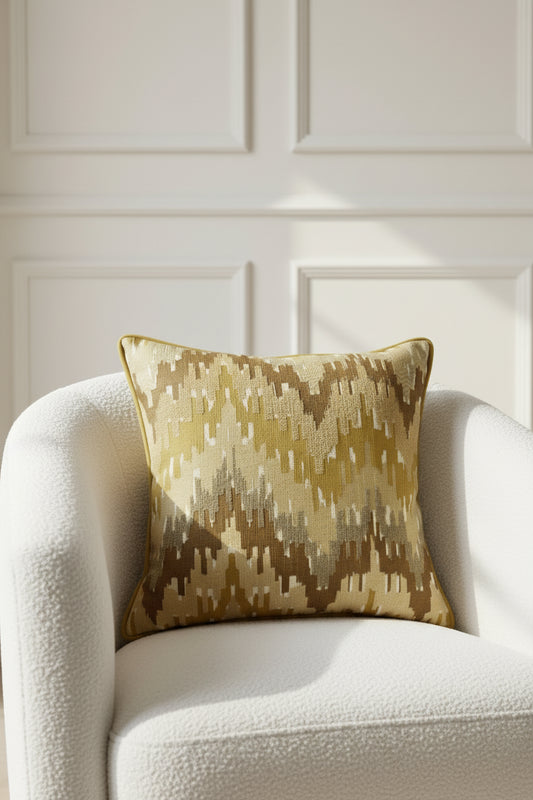 Decorative pillow with geometric pattern on a beige background