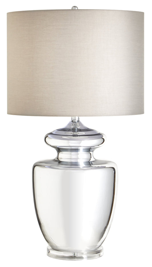Clear glass table lamp with a beige lampshade on a white background